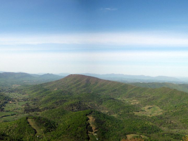 Panoramic view from the rock ledge of McAfee Knob over forested Virginia ridges